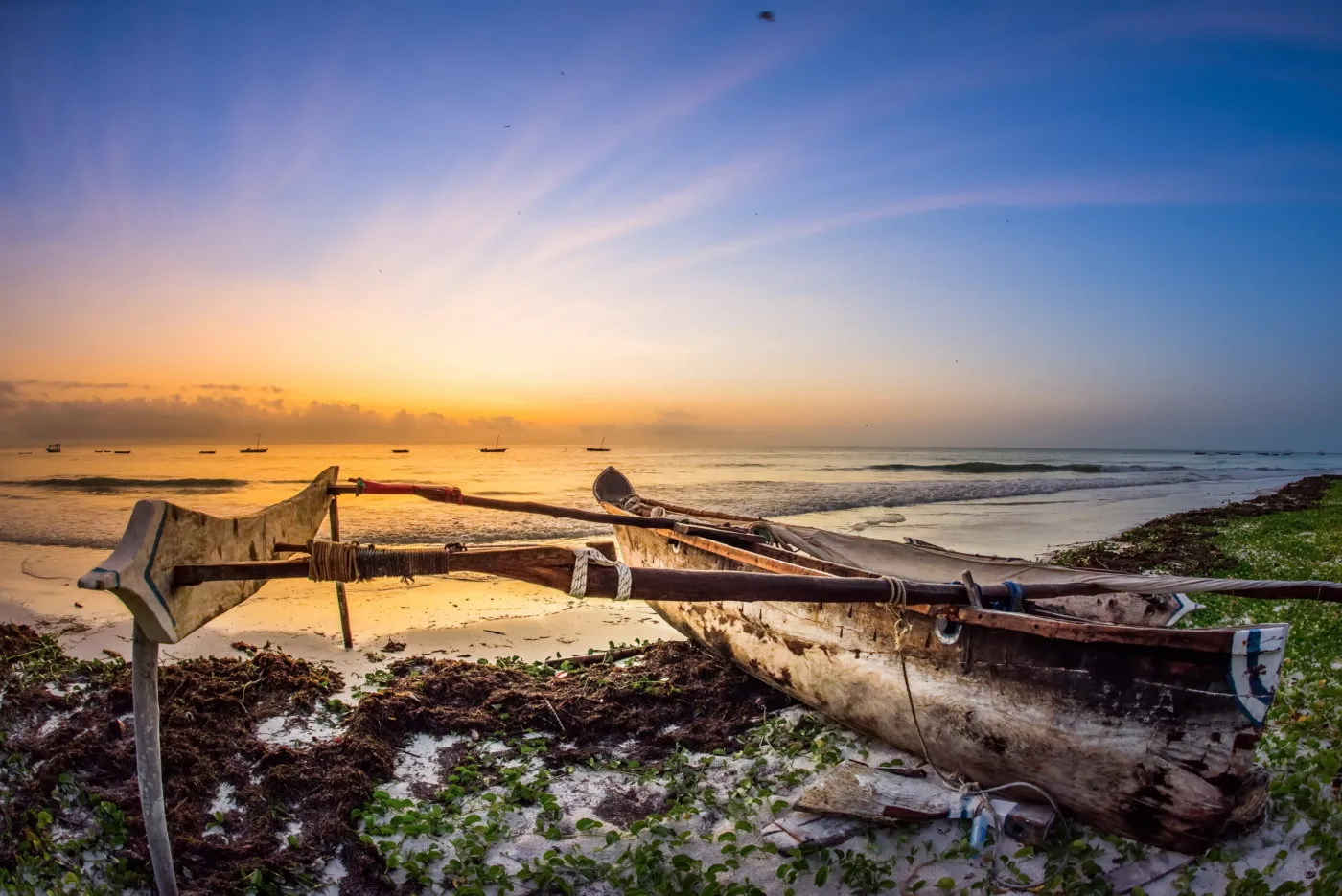 Traditional dhow on the beach at sunrise